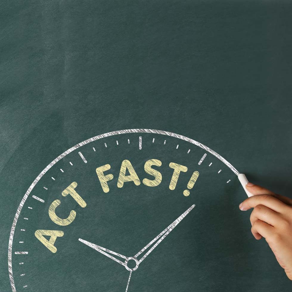 Person drawing speedometer on chalk board with text reading "Act Fast!"