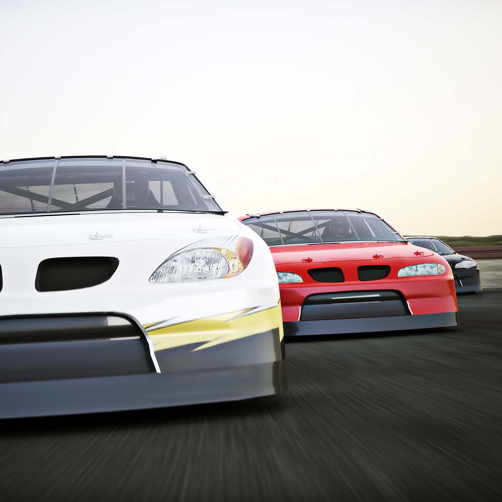 Three race cars in white, red, and black