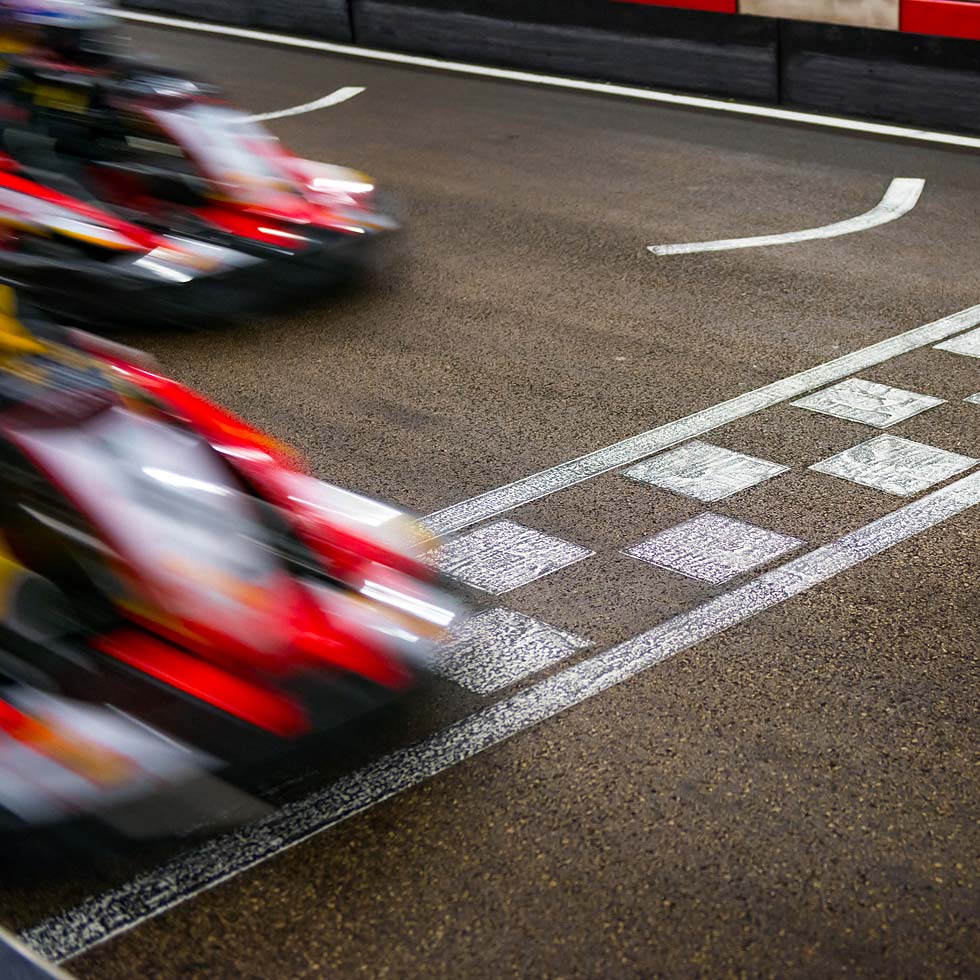 Race cars crossing the finish line