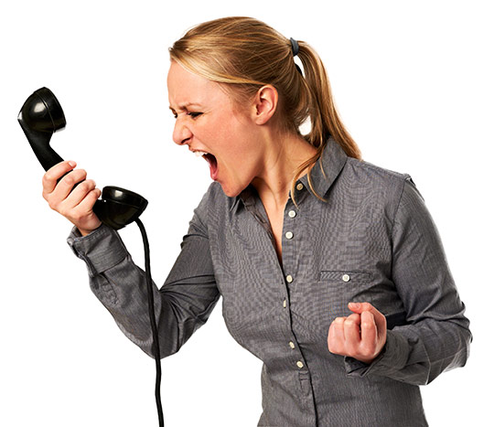 Woman screaming into a phone