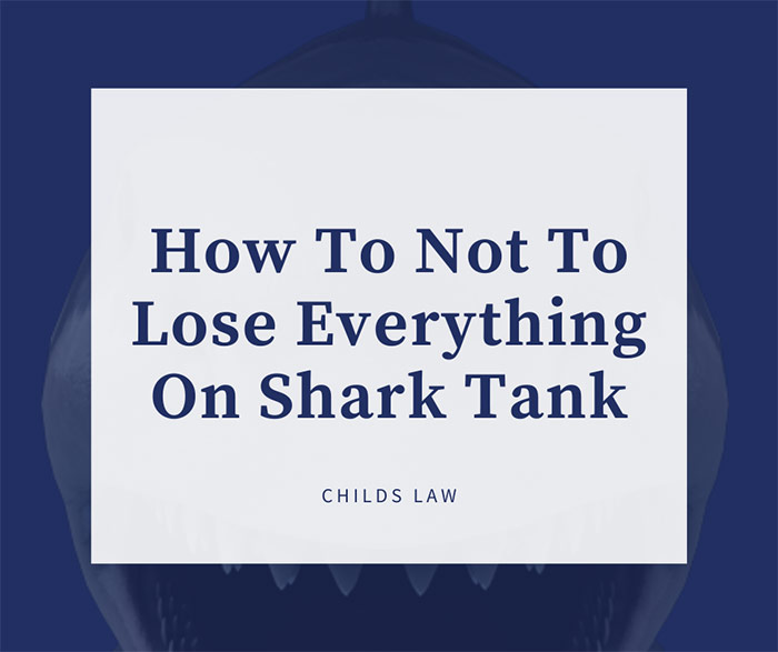 Dark blue serif type with white background over image of shark